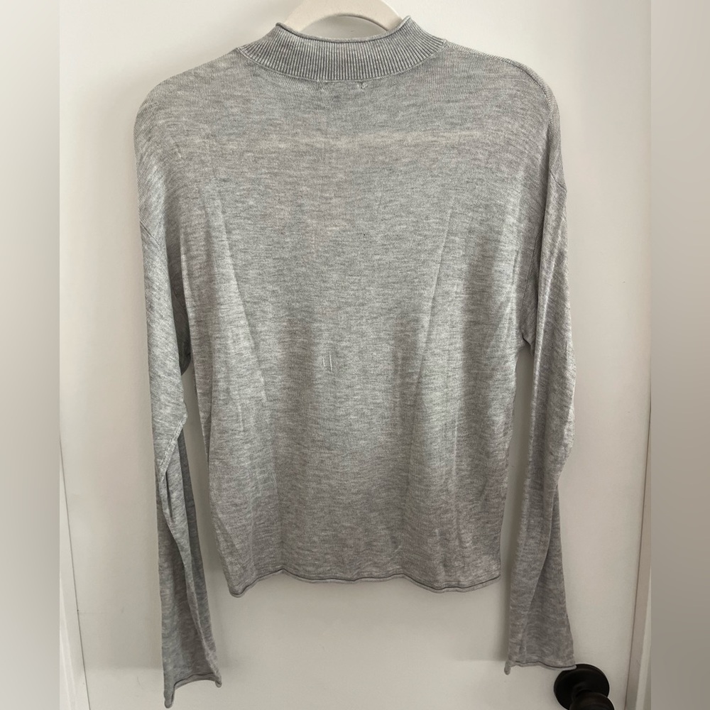 Tissue Thin Sheer Turtleneck. Slight dolman sleeve.